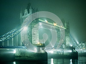 Tower Bridge in fog at night