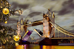 Tower Bridge lift time against Christmas tree in London, UK