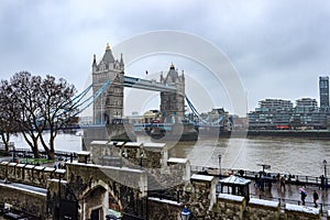 Tower Bridge of London snowing winter day.