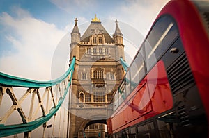 Tower Bridge with Red Double Decker bus passing by. London, UK.