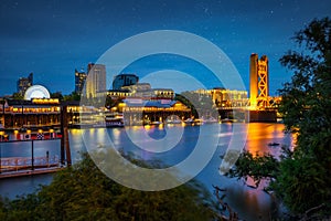 Tower Bridge and Sacramento River in Sacramento, California, captured at night