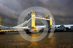 Tower bridge at sunset under a leaden sky