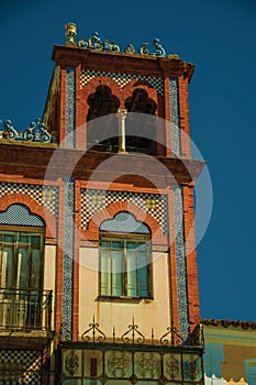 Tower on building with ceramic and bricks details at Merida