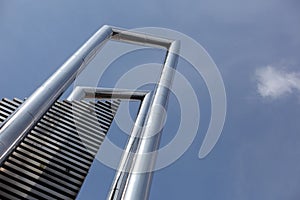 Tower and building that soars into the blue sky