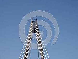 The tower and cables on the marine way suspension bridge in southport merseyside against a blue summer sky