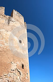 Tower of a castle over a blue sky