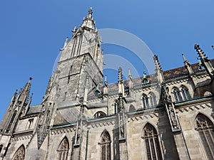The tower of a cathedral against a blue sky