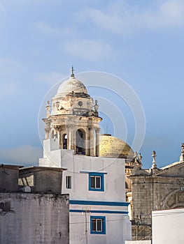 Tower of the Cathedral of Cadiz (Catedral de la Santa Cruz de CÃÂ¡diz), as seen from the narrow street photo