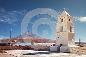 Tower of the church of Cariquima, near Colchane, in the Tarapaca region, in the foothills of the Cariquima mountain, Chile photo