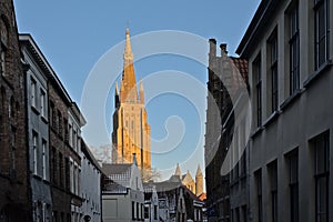 Tower of the church of our Lady in the winter evening sun in Bruges