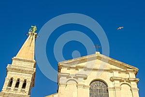 The Tower of The Church of St. Euphemia on the background of blue sky in Rovinj, Croatia