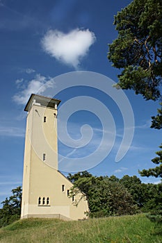 A tower with a cloud in heart shape