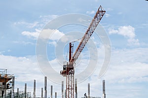 Tower construction crane in building construction site with blue sky background