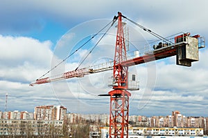 Tower construction crane over city