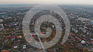 Tower from copter flying up at the small cityscape old architecture houses Uzhhorod Ukraine Europe