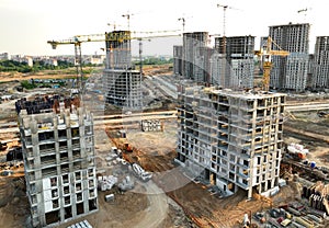 Tower crane on building construction, top view. Builder on formworks