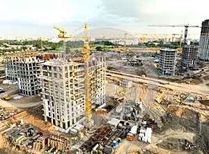 Tower crane on building construction, top view. Builder on formworks