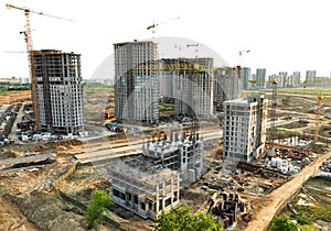 Tower crane on building construction, top view. Builder on formworks