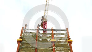 Tower crane on building moving I-beam