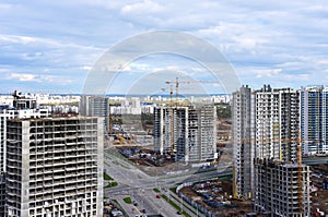 Tower crane during construction of a residential building. Cranes on formworks. Construction the building or multi-storey homes,