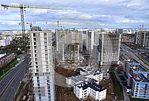 Tower crane during construction of a residential building. Cranes on formworks. Construction the building or multi-storey homes,