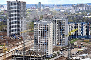 Tower crane during construction of a residential building. Cranes on formworks. Construction the building or multi-storey homes,