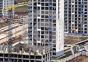 Tower crane during construction of a residential building. Cranes on formworks. Construction the building or multi-storey homes,