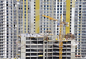 Tower crane during construction of a residential building. Cranes on formworks. Construction the building or multi-storey homes,