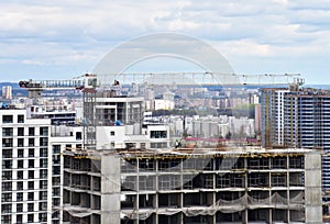 Tower crane during construction of a residential building. Cranes on formworks. Construction the building or multi-storey homes,