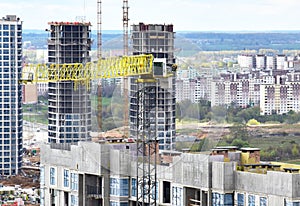 Tower crane during construction of a residential building. Cranes on formworks. Construction the building or multi-storey homes,