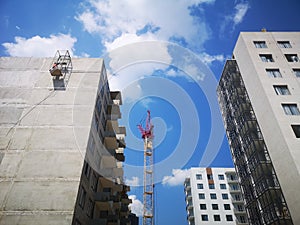 tower crane at the construction site. Construction of apartments in a new residential complex of apartment buildings