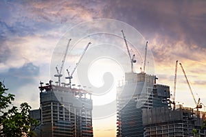 about the tower crane at the construction site event evening looking from below