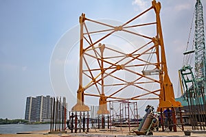 about the tower crane by emphasizing at foundation and basic mast