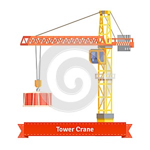 Tower crane lifting building materials on the hook