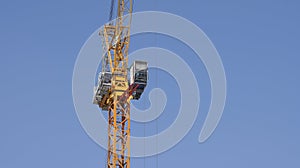 Tower crane soars into blue sky