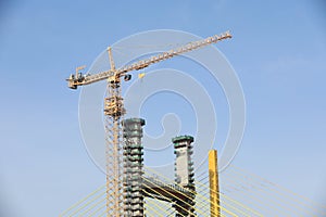 Tower crane at suspension bridge construction site