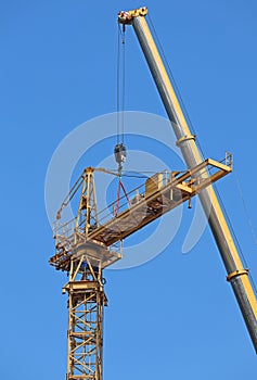 Tower crane under assembly against sky
