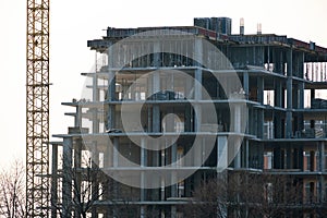 Tower cranes and high residential apartment buildings under construction. Real estate development