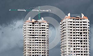 Tower cranes and two construction building