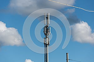 Tower with different types of cellphone transmitters and antennas
