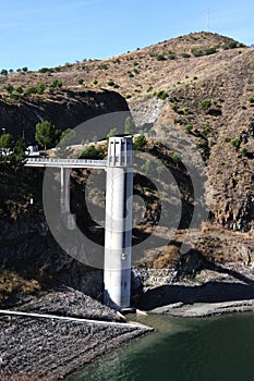 Tower on edge of reservoir, Malaga, Spain. photo