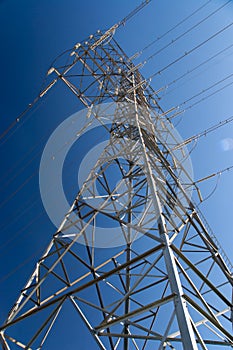 Tower of electrical high voltage power on blue sky