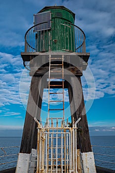 A tower at the end of Whitby Harbour wall