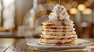 A tower of fluffy pancakes stacked high and drizzled with warm maple syrup and topped with a dollop of whipped cream photo