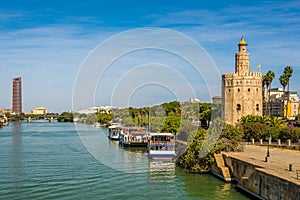 Tower of gold Torre del Oro with Guadalquivir river in Sevilla, Spain
