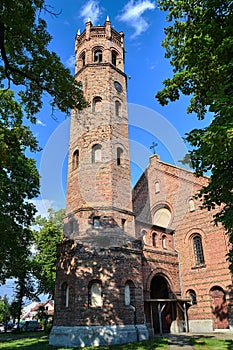The tower of the historic, Gothic red brick church in the city of Skwierzyna