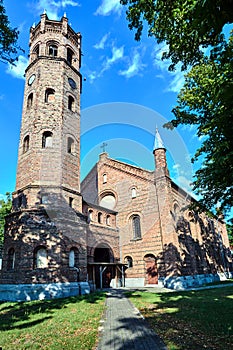 The tower of the historic, Gothic red brick church in the city of Skwierzyna