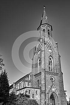 The tower of the historic, neo-Gothic red brick church in the village of Sokola Dabrowa