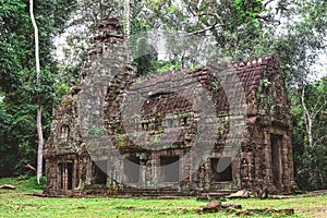 Tower, huge trees and galleries in Preah Khan Temple