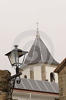 Tower and lamppost in the Sanctuary of Nuestra SeÃÂ±ora del CastaÃÂ±ar, in Bejar, Salamanca, Castilla Leon, Spain. photo